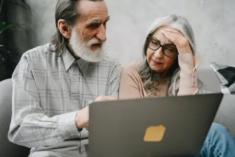 an image of two people discussing