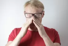 an image of a man experiencing digital eye strain