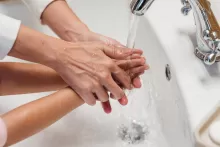 an image of hands preparing contact lens for wearing