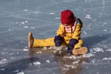 an image of a kid playing on ice